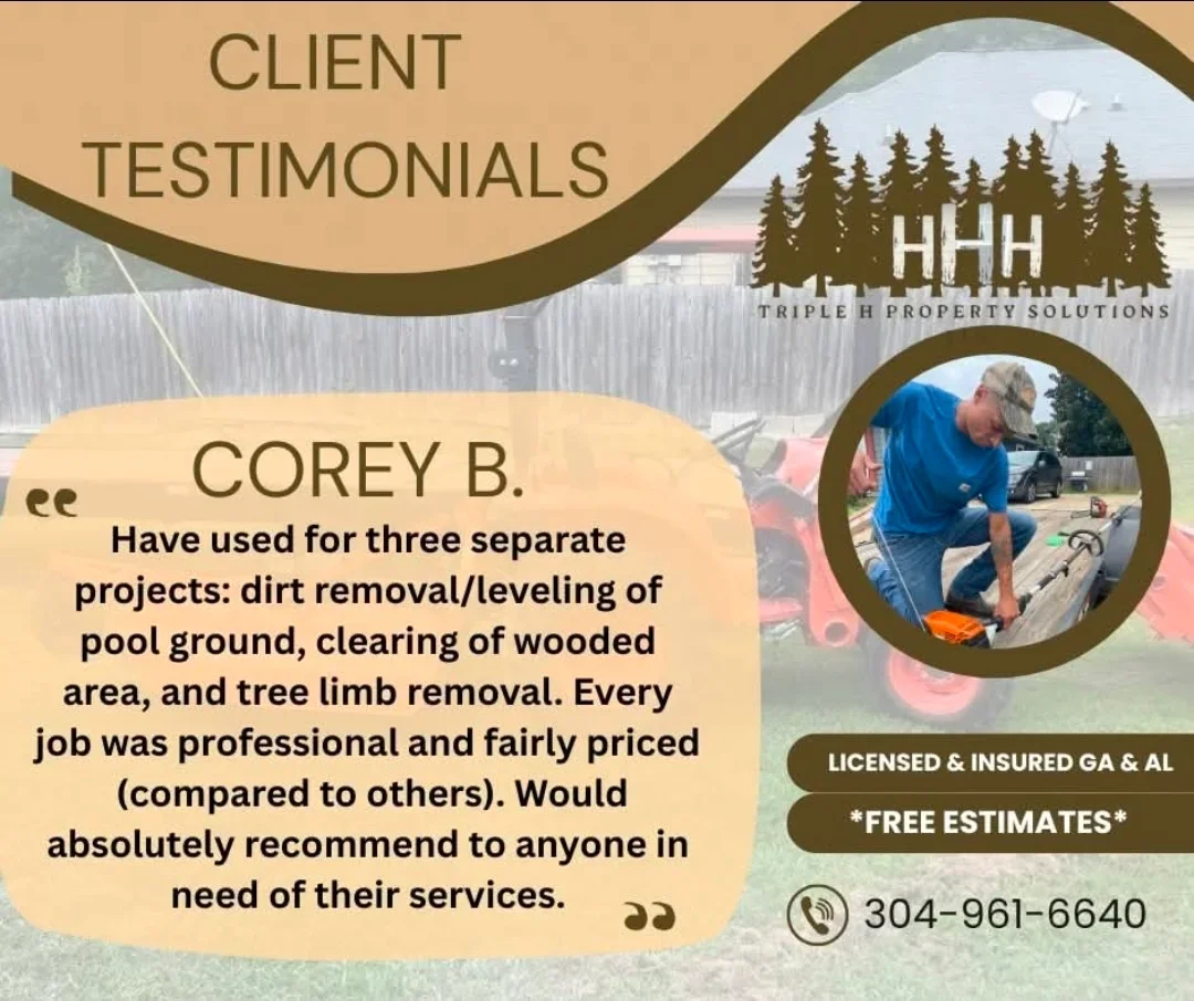 Worker operating equipment for dirt removal and site leveling near residential property with wooded background